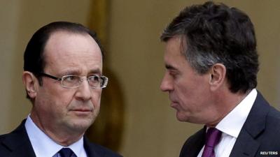 French President Francois Hollande speaks with former minister Jerome Cahuzac