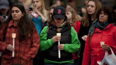 People at candlelight vigil in Boston