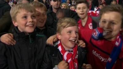 Young fans celebrate Cardiff City's promotion