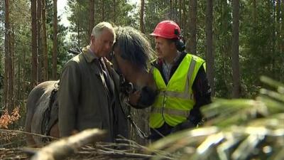 Prince Charles talks to an estate worker in Balmoral