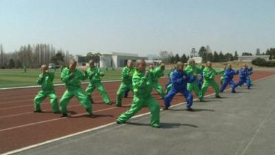 North Korean children training on the school's sports ground