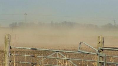 Soil being carried by the wind in a 'fen blow'