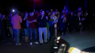Crowds cheer police cars in Boston