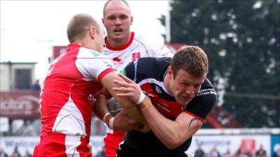 St Helens' Josh Jones tackled by Hull KR's Michael Dobson