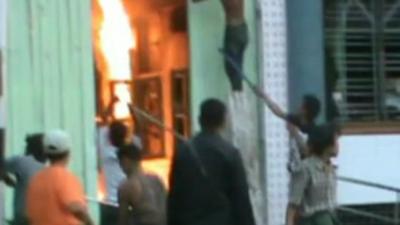 Burmese men attack building