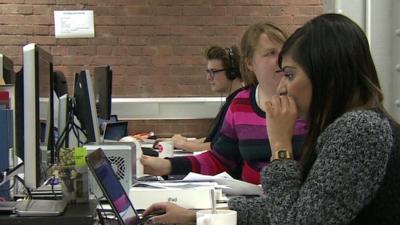 Workers sitting at computers