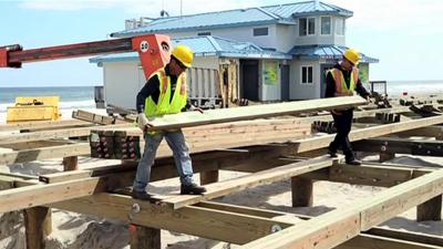 Workers repairing the boardwalk in New Jersey Shore.