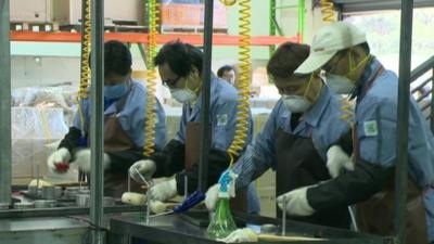 Workers at a makeshift factory in South Korea