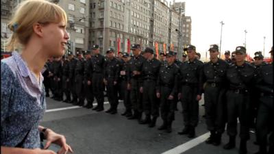 Russian police line up to block a demonstration in Moscow