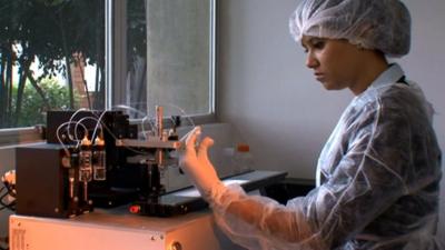 A woman working in a laboratory