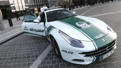 Dubai policewoman and Ferrari patrol car