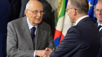 Italian prime minister-designate leftist Enrico Letta (R) shakes hand with President Giorgio Napolitano