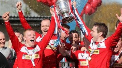 George McMullan and Chris Scannell lift the Gibson Cup