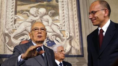 Italian Prime Minister-designate and deputy leader of the centre-left Democratic Party (PD) Enrico Letta (R)