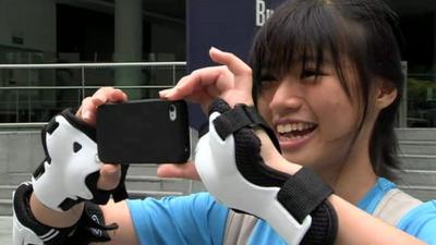 Young woman in Singapore using her smartphone