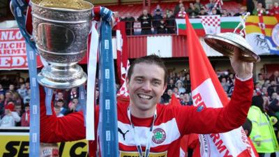 Chris Scannell celebrates with the Gibson Cup