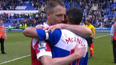 QPR's Clint Hill and Reading's Jobi McAnuff embrace at the final whistle