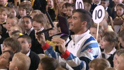 Louis Smith with pupils at Werrington Primary School
