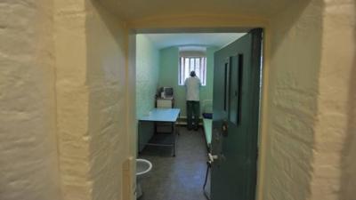 A prisoner in a cell at Wormwood Scrubs