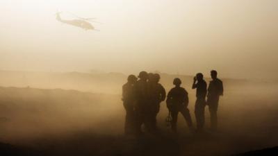 British soldiers silhouetted during training in Helmand