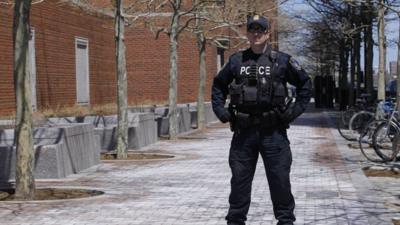 Police officer outside courthouse