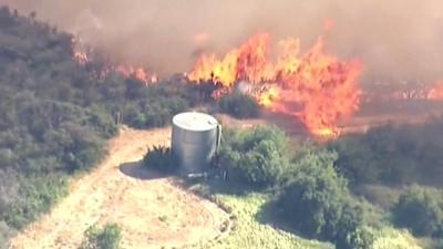 Aerial view of flames on farmland