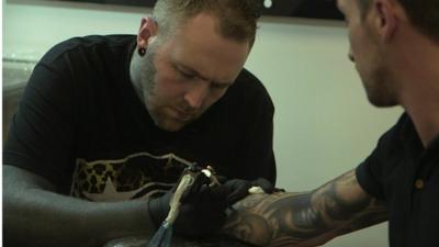 Tattoo artist Kevin Paul at work