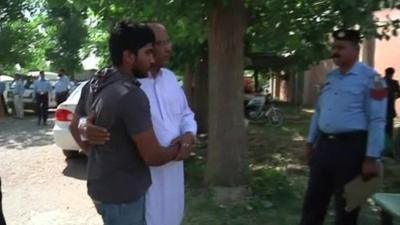 Chaudhry Zulfiqar's son being comforted