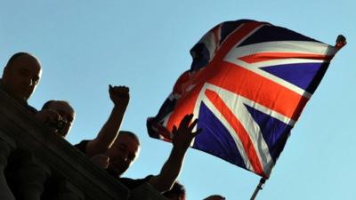 Workers fly the Union Flag