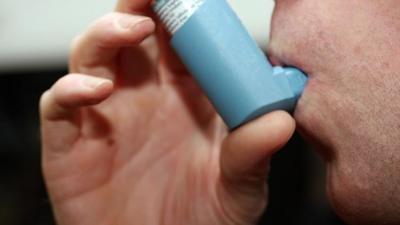 Man using inhaler