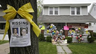 Missing poster, balloons ad tributes left outside Amanda Berry's home