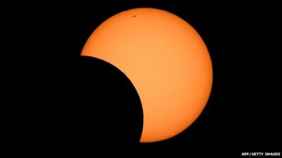 The moon crosses in front of the sun as seen from the Sydney Observatory during an annular eclipse on May 10, 2013