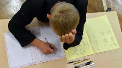 Boy taking an exam.