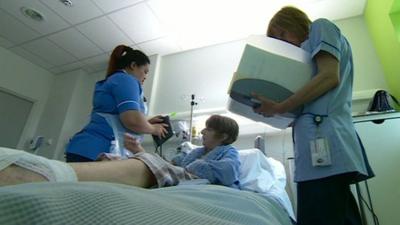 Nurses caring for a patient