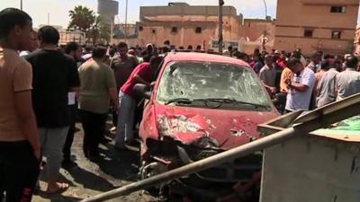 A damaged car in Benghazi