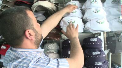 Man with 'Free Syrian Army' baseball caps