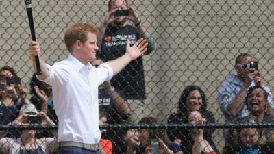 Prince Harry playing baseball