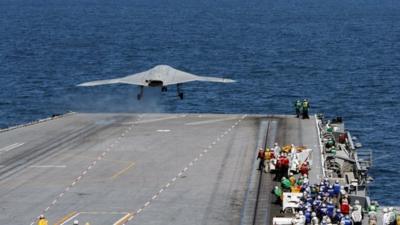 An X-47B Unmanned Combat Air System launches from the flight deck of the aircraft carrier USS George H.W. Bush.