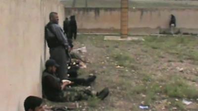 Online video footage claimed to show rebel fighters flanking the prison walls