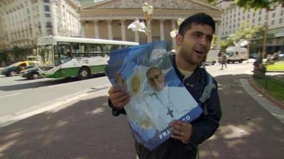 Man advertising Pope Francis bus tours