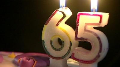 Candles in the shape of the number 65