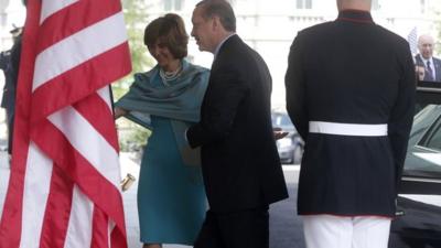 Turkish Prime Minister Recep Tayyip Erdogan is greeted by U.S. Chief of Protocol Capricia Marshall as he arrives to meet with President Barack Obama at the White House in Washington