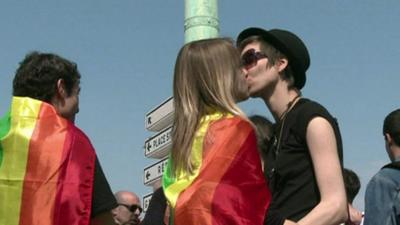 Same sex couple kissing