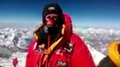Daniel Hughes at the top of Mount Everest