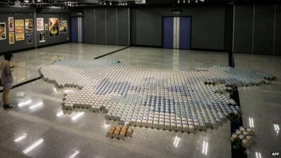 A map of China contructed from tins of milk