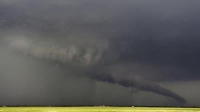 The funnel of a tornado almost touches the ground near South Haven, in Kansas