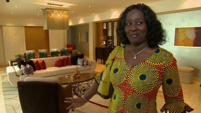 Ghanaian woman in luxury Accra apartment