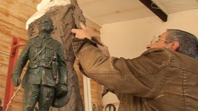 Artist John Doubleday at work on the statue