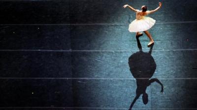 A ballerina performs during a dress rehearsal