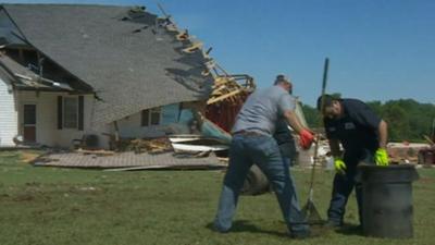 Men cleaning up after the tornado